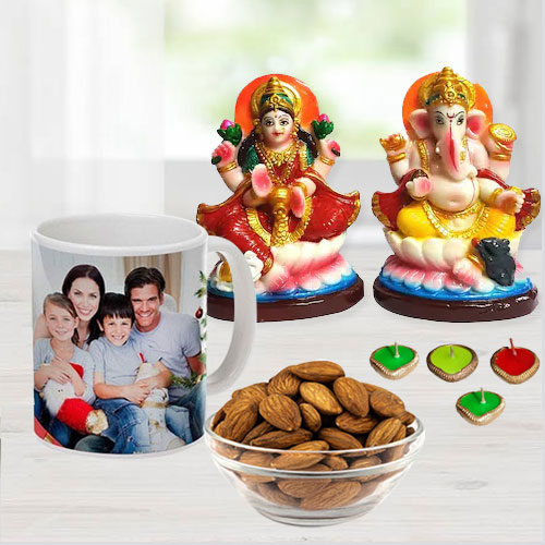 Prosperous Ganesh Laxmi Idol with Personalized Coffee Mug Cadbury Chocolates n Almonds Free Wax Diya