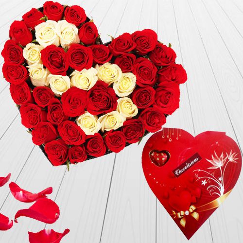 Hearty Arrangement of Red n White Roses with Heart Shape Handmade Chocolates Box