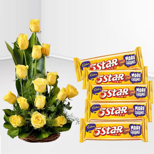 Cheerful Display of Yellow Roses in Cane Basket with Cadbury 5 Star